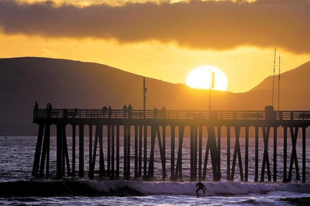 Sunset watchers, fishermen and surfers all found time to hang out at the Pismo Pier in this file photo.